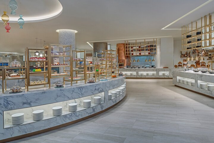 Indulge in over 220 dishes and 20 live cooking stations offering a delightful culinary journey through Asia and beyond at Dubai's largest buffet experience.